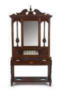 An antique English walnut hallstand with tile back and black marble top, late 19th century, 227cm high, 126cm wide, 32cm deep