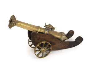 An antique Spanish miniature cannon, solid cast bronze on timber carriage, 19th century, ​52cm long overall
