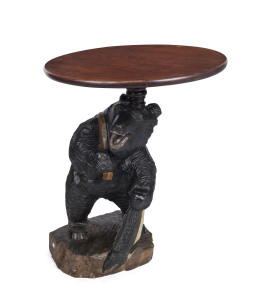 Black Forest style occasional table with carved bear base, mid 20th century, 78cm high, 55cm diameter