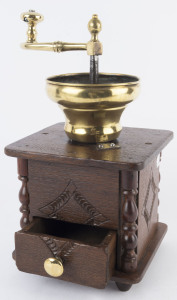 An antique oak and brass coffee grinder by J. A. Maus, 19th century, 34cm high