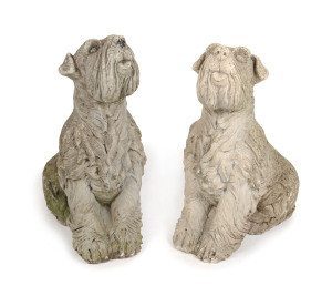 A pair of composition stone terrier dog garden statues, 20th century, 70cm high,