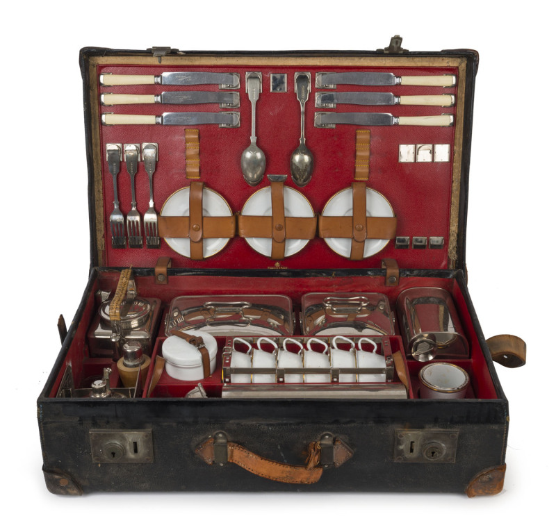 A stunning early automotive picnic set by "EDWARDS & SONS, REGENT STREET, LONDON", early 20th century, comprising stainless steel, enamel and silver plated cutlery, cannisters, warmers, containers etc., the case 62cm wide