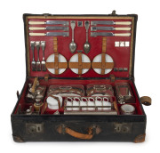 A stunning early automotive picnic set by "EDWARDS & SONS, REGENT STREET, LONDON", early 20th century, comprising stainless steel, enamel and silver plated cutlery, cannisters, warmers, containers etc., the case 62cm wide