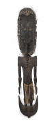 An impressive figural food hook, carved wood, feather, shell and fibre with remains of earth pigments, Papua New Guinea, ​177cm high