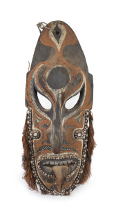 An ancestral mask, carved wood, shell, fibre and earth pigments, Tanbanum Village, Middle Sepik, Papua New Guinea, ​80cm high