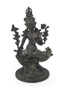 A Tibetan bronze seated Tara statue with dragon and lotus, 19th century, 36cm high. Note: A similar example can be found in the Museum Guimet in Paris which is also illustrated in "Arts Of Asia" Nov.-Dec. 1975, page 35, catalogue 35.