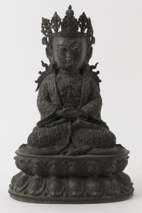 A Tibetan bronze statue of Amitayus wearing a crown and necklaces seated on a double lotus, 19th century, 35cm high