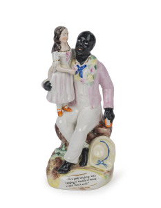 UNCLE TOM & EVA Staffordshire pottery figural group, second half 19th century, the base inscribed with quote from Harriet Beecher Stowe's Uncle Tom's Cabin (1856) "Eva gaily laughing was hanging a wreath of roses round Tom's neck". 20cm high.
