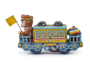MONKEY CAR EXPRESS: wind-up (no key) tin litho toy train, monkey conductor waves flag and bell rings when operating; length 15cm; made in Japan, c.1950s.