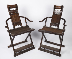 A pair of Chinese rosewood folding yoke chairs, 20th century, 120cm high, 66cm across the arms