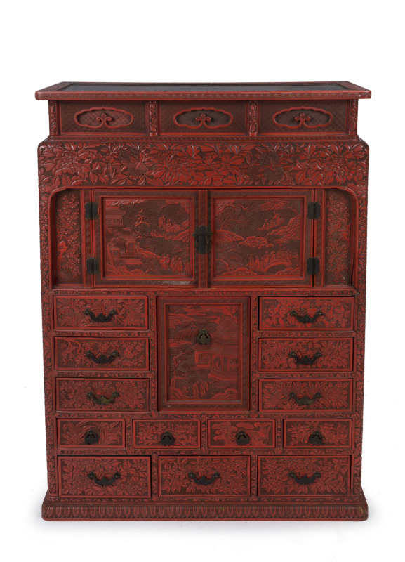 An antique Japanese red lacquered cabinet, profusely decorated on all sides. 18th century. 117cm high, 82cm wide, 34cm wide. PROVENANCE: Purchased from Spink & Son Ltd. London in 1927 for £200. formerly part of the Anderson Collection, England.