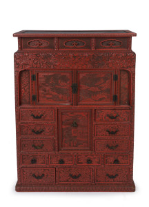 An antique Japanese red lacquered cabinet, profusely decorated on all sides. 18th century. 117cm high, 82cm wide, 34cm wide. PROVENANCE: Purchased from Spink & Son Ltd. London in 1927 for £200. formerly part of the Anderson Collection, England.