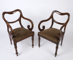 A pair of English mahogany saddleback carver chairs with drop-in seats and ring turned legs, circa 1850, 51cm across the arms