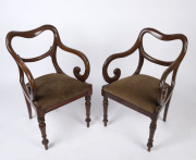 A pair of English mahogany saddleback carver chairs with drop-in seats and ring turned legs, circa 1850, ​51cm across the arms