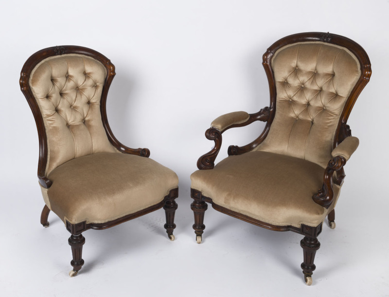 An antique pair of English walnut ladies and gents parlour chairs with diamond button velvet upholstery, circa 1870, the gents chair 68cm across the arms