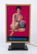 SANYO - ADVERTISING: vintage illuminating counter top sign, promoting portable miniature TV on one side and vacuum cleaner on the other; 47cm high, 25cm wide, 11cm deep, c.1970s. - 2