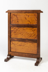 An antique Australian fire screen, mottled kauri and blackwood, circa 1900, 67cm high, 53cm across