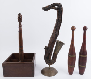 A pair of calisthenics clubs, a timber decanter stand and a saxophone ornament by Patricia McNamara of Daylesford, 20th century (4 items)