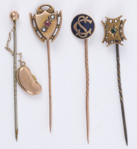 Four antique gold stickpins including enamel, emerald, ruby and seed pearl, 19th and early 20th century, 6cm high