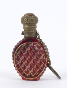 An antique Bohemian scent bottle, cut ruby glass with gilt metal mounts, 19th century, missing internal stopper, 7cm high