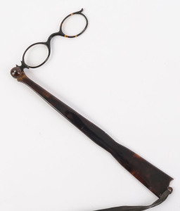 Antique tortoiseshell lorgnette with original black silk lanyard, late 19th century, ​the handle 23cm long