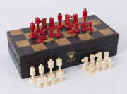 CHESS SET, carved whalebone, housed in original fitted folding games box, early 20th century, ​the box 29.5cm wide