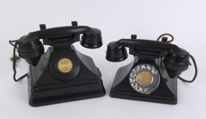 Two vintage black bakelite telephones, one an exchange handset without dialling mechanism, the other of smaller size with dialing mechanism, the larger 18cm hig