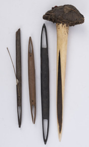 Asmat bone dagger; together with three fishnet weaving shuttles, Solomon Islands, the dagger 37cm long