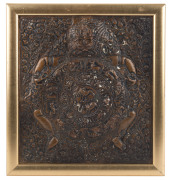 An antique Tibetan repouss&eacute; copper plaque, 19th century, ​29 x 27cm