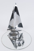 Two chrome yacht ashtray ornaments with glass circular base (3 items), circa 1930, the largest 32cm high