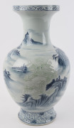 A Chinese blue and white porcelain mantel vase with embossed celadon dragons in mountain landscape, 20th century, square seal mark to base, ​53cm high - 2