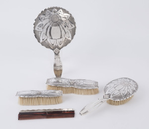 A five piece Dutch silver Art Deco vanity set, circa 1925, the mirror 30cm high