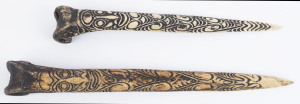 Two bone daggers with carved decoration, Papua New Guinea, ​40cm and 33cm long