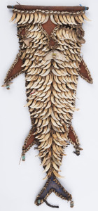 A pectoral chest ornament, dog's tooth, shell, trade bead, fibre, ochre and blue paint, Ramu River, Papua New Guinea, ​48cm high