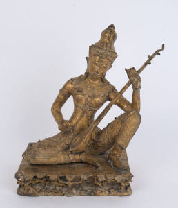 A Thai seated gilt bronze statue of a musician, 19th/20th century, 37cm high