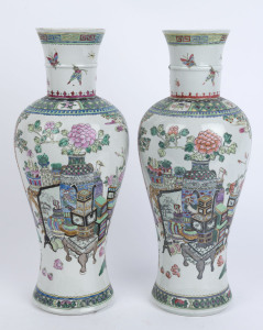 A pair of Chinese porcelain baluster shaped vases decorated in polychrome enamels with outdoor scenes, peonies and court officials, 20th century, 46cm high