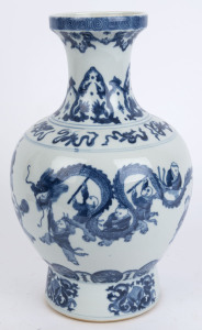 A Chinese blue and white "Hundred Boy" porcelain baluster shaped vase decorated on the shoulder with the eight treasures, 20th century, Guangxu six character mark to base but later, 38cm high