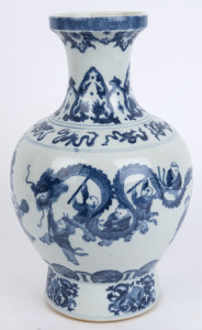 A Chinese blue and white "Hundred Boy" porcelain baluster shaped vase decorated on the shoulder with the eight treasures, 20th century, Guangxu six character mark to base but later, ​38cm high
