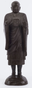 A Sino-Tibetan ceramic statue of a monk, 19th century, 36cm high