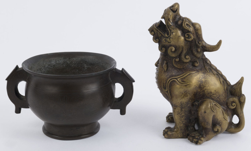 A Chinese bronze seated dragon statue, four character Ming mark but later; together with a Chinese two handled bronze censer with silver inlay, three character mark to base, 19th and 20th century, (2 items), statue 16cm high, censer 9cm high, 16cm wide