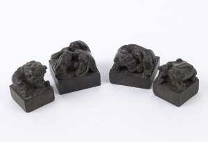 Four Chinese bronze seals with Chi-long dragon finials, Qing Dynasty, 19th century, the largest 3.5cm high