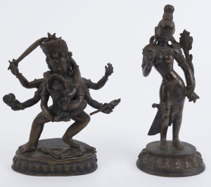 A Tibetan bronze statue of a six armed demonic figure with his consort; together with an Indian bronze statue, 19th/20th century, 17.5cm and 21.5cm high