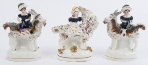 Three antique English Staffordshire pottery statues of girls riding goats, early 19th century, the largest 16cm high