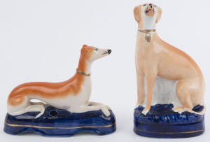 Two antique Staffordshire pottery dog statues, 19th century, the larger 20cm high