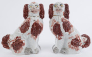 A pair of Staffordshire pottery spaniels, 19th century, ​24cm high