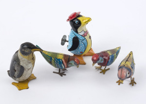 TIN LITHO WIND-UP BIRDS: with INAKITA (Japan) waddling Penguin wearing hat (with key, in working order), plus another Penguin marked 'Made in Gt Britain'; also three pecking birds made by Fairylite (UK), Prestyn (UK) or D.R.G.M. (Germany); latter items al