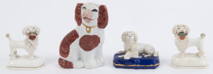 Four assorted Staffordshire pottery dog statues,19th century the largest 13cm high