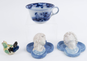 A pair of antique French ceramic face plaques, pottery bird and an antique English porcelain oversized teacup, 19th century, (4 items), the teacup 9cm high, 19.5cm wide