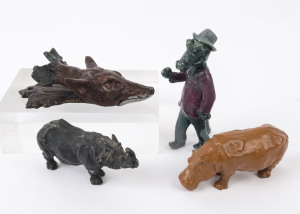 CAST METAL ANIMAL & BIRD FIGURES: with brass 'snapping jaw' Wolf's Head mounted on brass wall plaque (length 15cm), also hollow cast crocodile figurine dressed in a suit (height 14cm), plus hollow cast rhinoceros and hippopotamus, c.1930s-50s. (4 items)