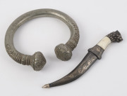 A slave bracelet currency ring together with a Indian miniature dagger with bidriware scabbard, (2 items), the dagger 16cm long